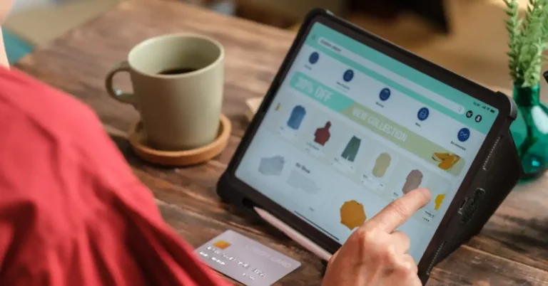 close up woman hand using credit card shopping online